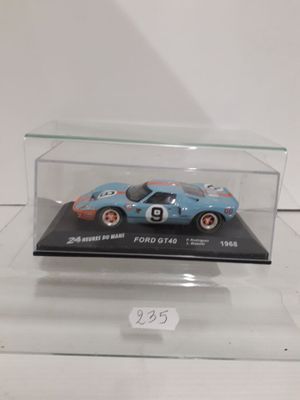 a close up of a toy car in a clear display case
