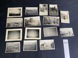 several old black and white photos of people and vehicles on a table