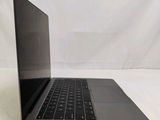 an open laptop computer sitting on top of a white surface