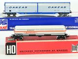 three toy trains sitting on top of each other on a table
