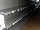 many empty shelves on the floor in a store