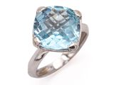 a close up of a ring with a blue topazt stone