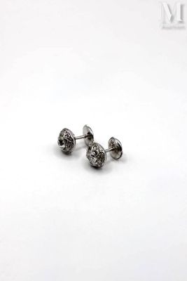 pair of diamond stud earrings on a white background