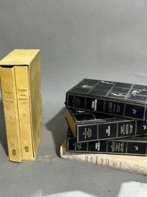 three books stacked on top of each other on a table