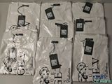 several white t - shirts with black and white designs are on a table