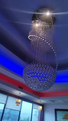 a large chandelier hanging from the ceiling in a room