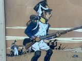 a picture of a painting of a soldier with a rifle
