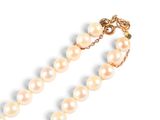 an image of a white pearl necklace on a gold chain