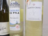 three bottles of wine sitting next to each other on a table