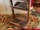 a small wooden table with a shelf on top of it