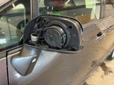 an image of a car with an electric charger attached to it ' s side mirror