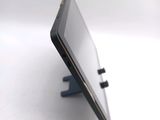 a close up of a cell phone on a stand