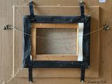 a picture of a box with a picture frame attached to it