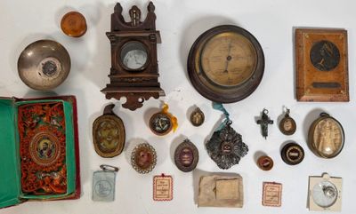 many different types of clocks displayed on the wall