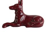 an image of a red dog figurine on a white background