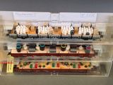 a display case with a bunch of lego trains in it