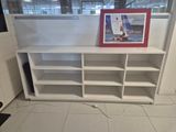 a picture of a picture of a sailboat on a shelf