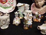 a lot of figurines that are sitting on a table