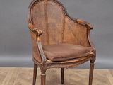an image of a wicker chair sitting on top of a hard wood floor