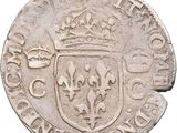 a close up of a coin with a crown on top of it