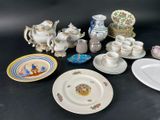 many plates and cups and saucers sitting on a table