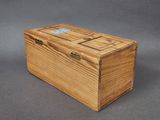an image of a wooden box on a gray surface