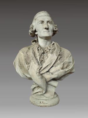 a white marble bust of a man wearing a suit and tie