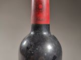 a bottle of wine that is sitting on a table