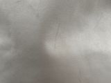 a close up of a white bag with a zipper on it