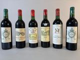 plusieurs bouteilles de vin sont alignées sur une table