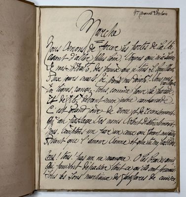 an old book with writing on it sitting on top of a table