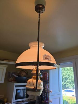 a lamp that is hanging from the ceiling in the kitchen