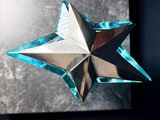 a close up of a metal object with a star on it