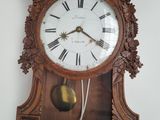 a clock that is hanging on the wall in the room