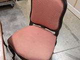 two chairs and a table in a room