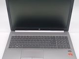 an open laptop computer sitting on top of a white table