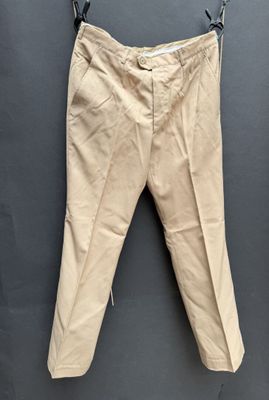 an old pair of pants hanging on a clothes line