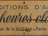 yellow sign with black writing on it that says editions d ' art le henes claires