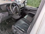 a view of the inside of a vehicle from the driver ' s seat