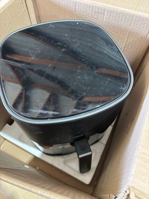 a box that has a black pan inside of it