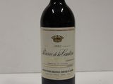 a bottle of wine that is sitting on a table