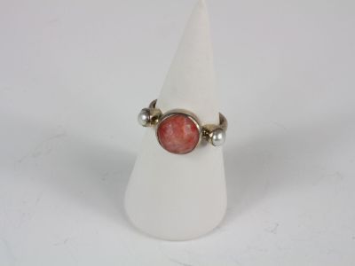 sterling silver ring with a red stone and pearls