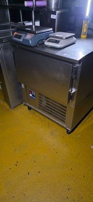 an image of a commercial kitchen with a lot of counter space