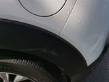 a close up of a car ' s tire on the street