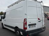 a white van that is parked in a parking lot
