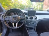the interior of a car with a steering wheel and dashboard controls