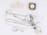 several pieces of jewelry including a clock, bracelets, and a necklace