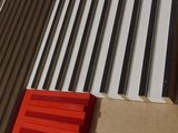 a red window on the side of a building