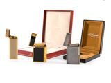 three different types of lighters in a box and a lighter in a case