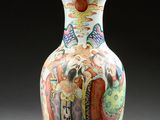 a vase with a handle that has a painting on it